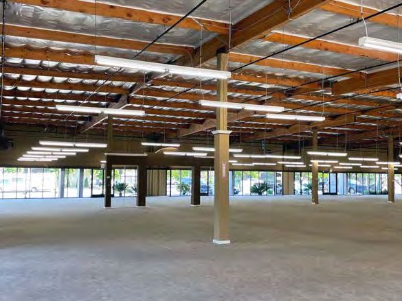 Vacant former showroom interior with glassline along the front wall